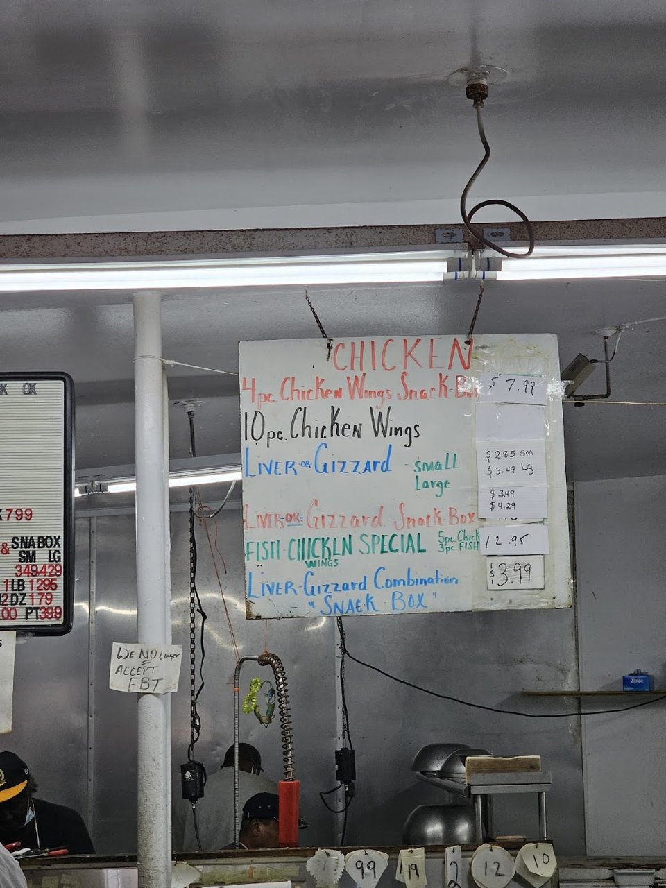 Crab cakes and lobster dishes listed.