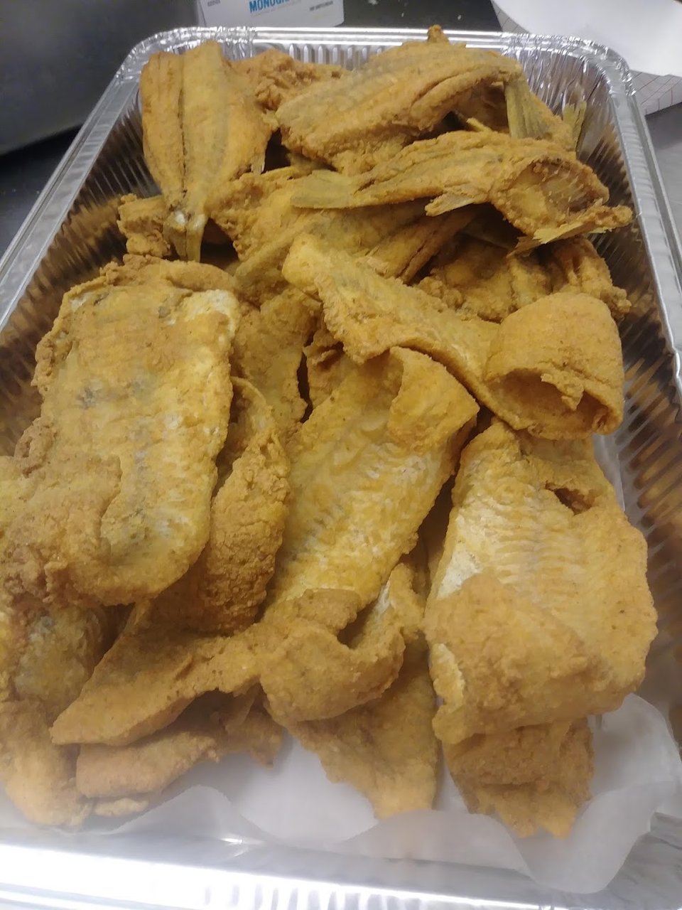 Printed menu with seafood specialties.